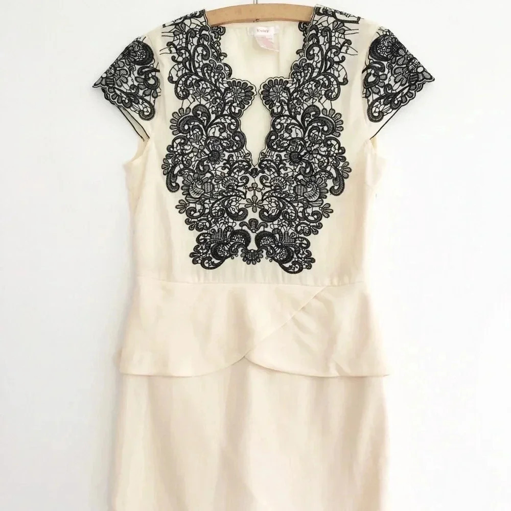 Esley Ivory and Black Lace Peplum Dress